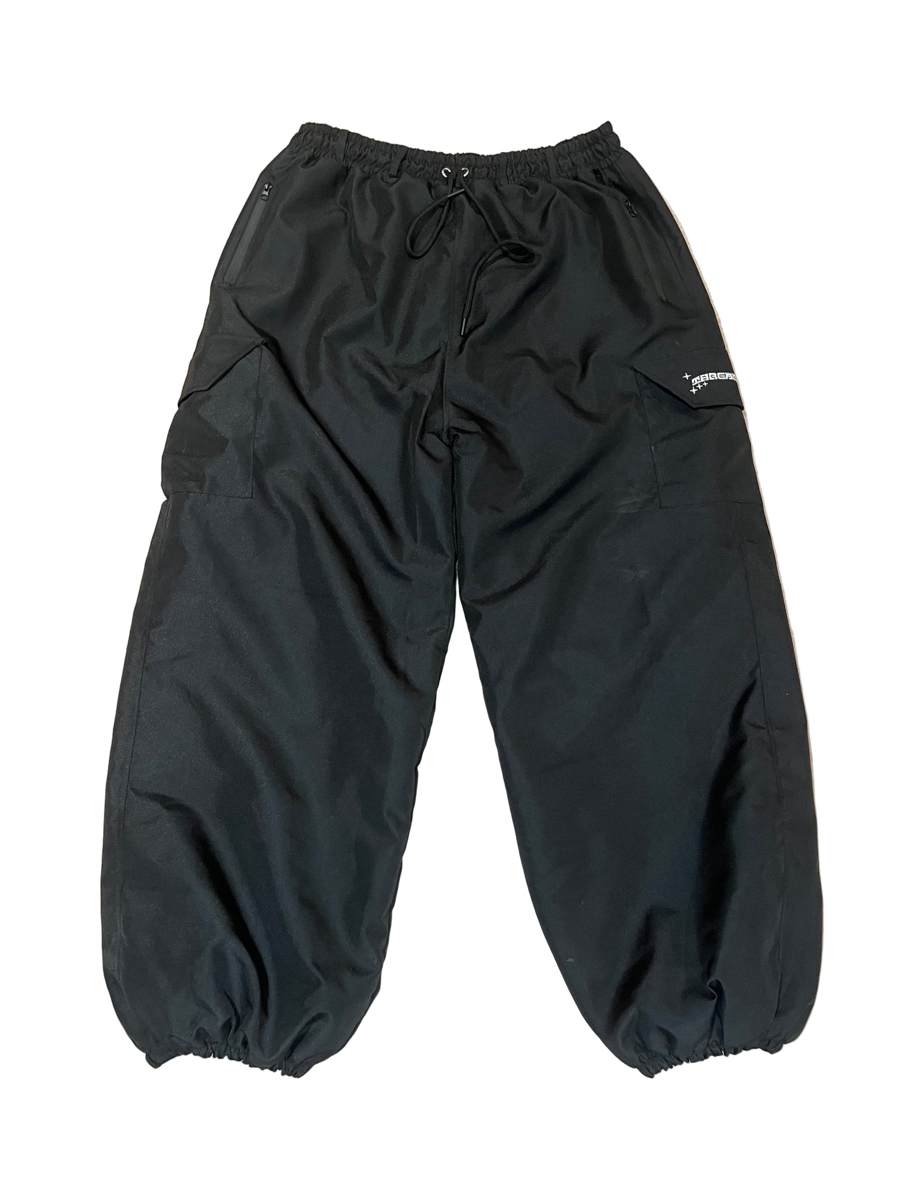 Black pants on a beige carpet