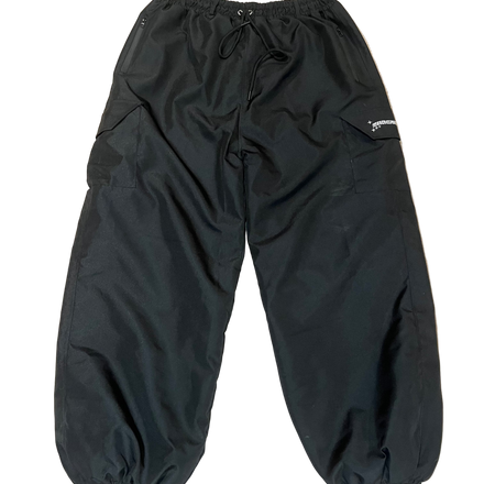 Black pants on a beige carpet