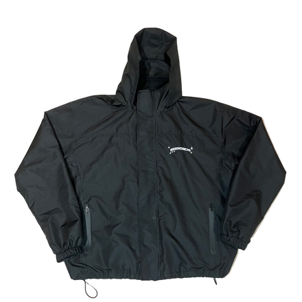 Black jacket with a brand logo on a beige carpet